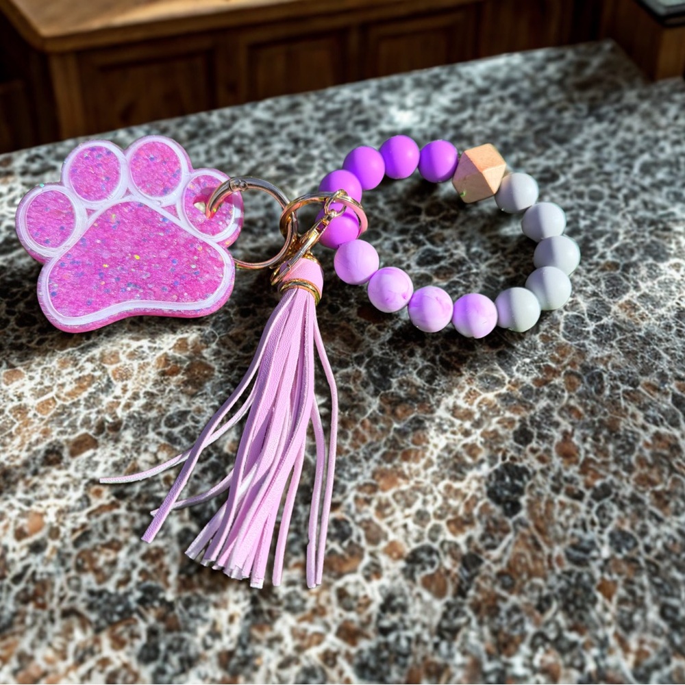 Vibrant Purple and Gray Paw Print Keychain with Tassel